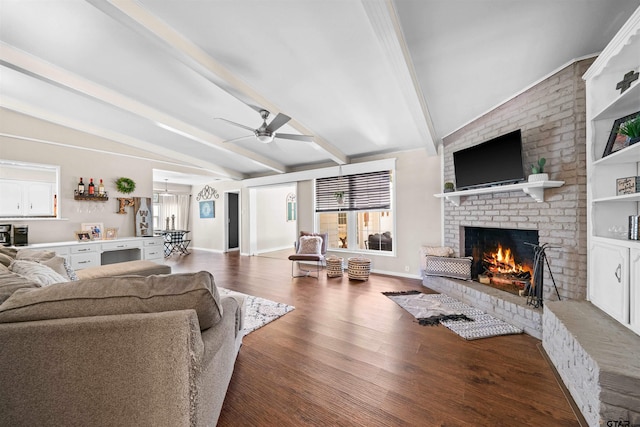 living room featuring ceiling fan, vaulted ceiling with beams, dark hardwood / wood-style floors, and a fireplace