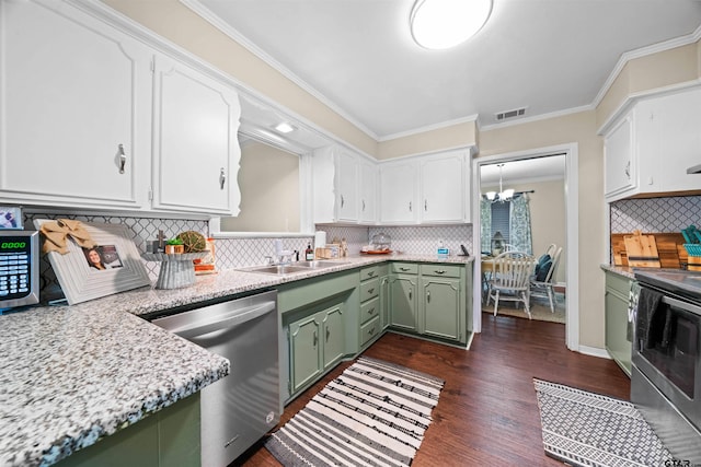 kitchen featuring dark hardwood / wood-style flooring, backsplash, green cabinetry, and stainless steel appliances