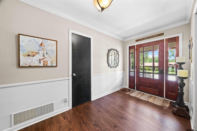 entrance foyer with dark wood-type flooring and ornamental molding