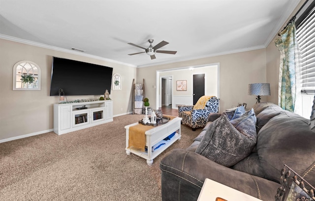 carpeted living room featuring ornamental molding, a wealth of natural light, and ceiling fan