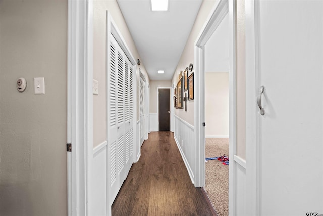 hall with dark hardwood / wood-style floors