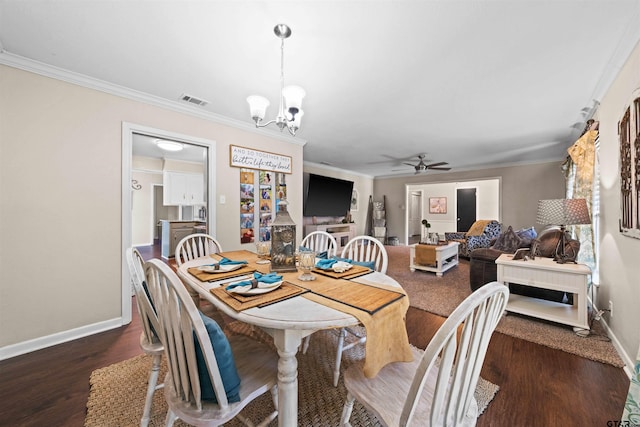 dining space featuring dark hardwood / wood-style flooring, crown molding, and ceiling fan with notable chandelier