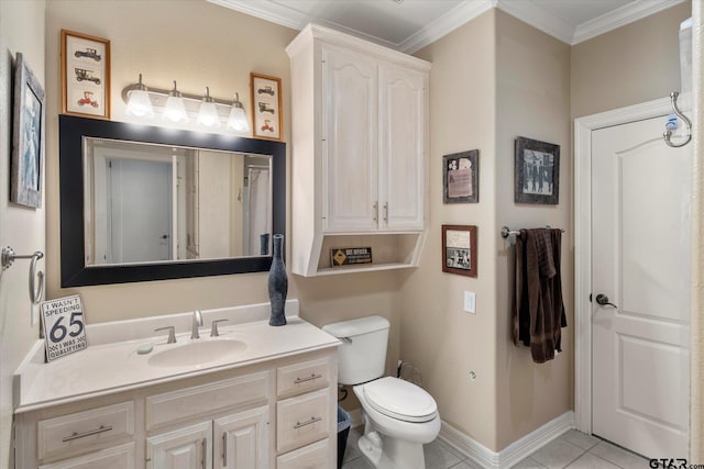 bathroom with ornamental molding, vanity, toilet, and tile patterned floors