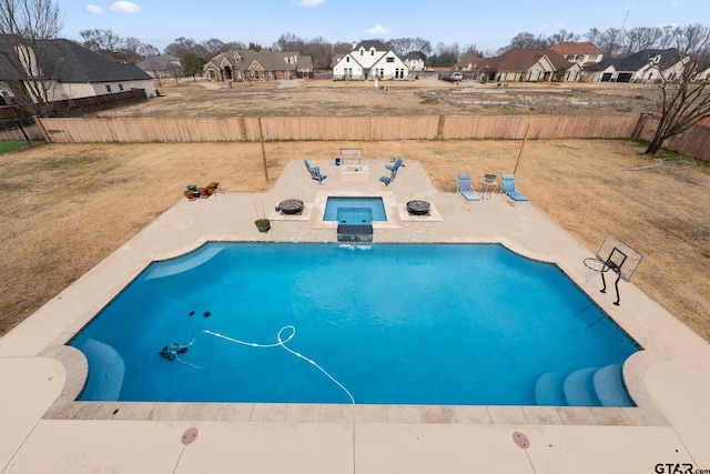 view of pool with an in ground hot tub