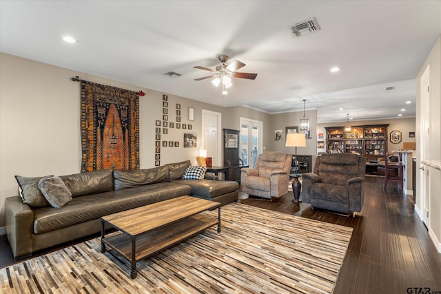 living room featuring ceiling fan and hardwood / wood-style floors