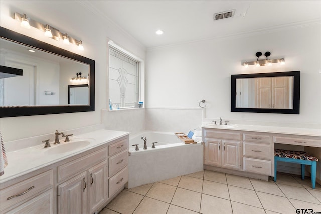 bathroom featuring vanity, crown molding, tile patterned floors, and a tub to relax in