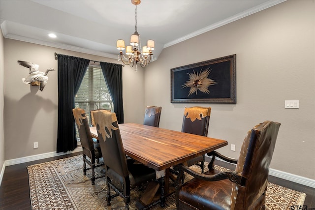 dining room with crown molding, a notable chandelier, and wood-type flooring