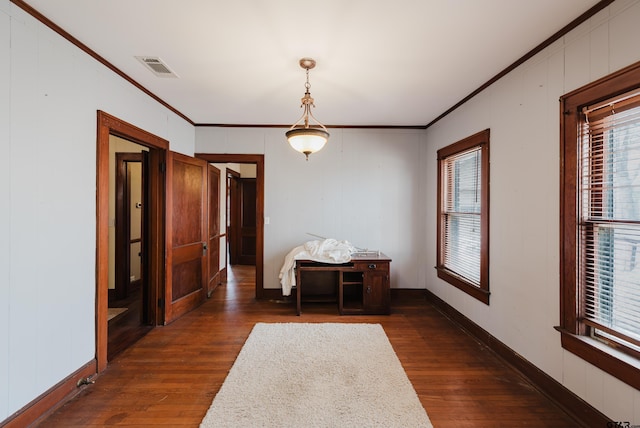 unfurnished dining area with visible vents, baseboards, dark wood-type flooring, and crown molding