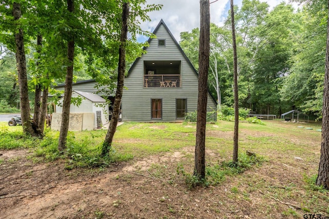15683 Crk 472, Tyler, TX 75706 - view of front of house with a balcony and a front lawn