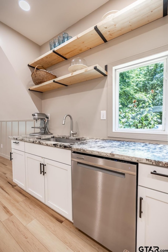 15683 Crk 472, Tyler, TX 75706 - kitchen with stainless steel dishwasher, open shelves, light wood-style flooring, and white cabinetry