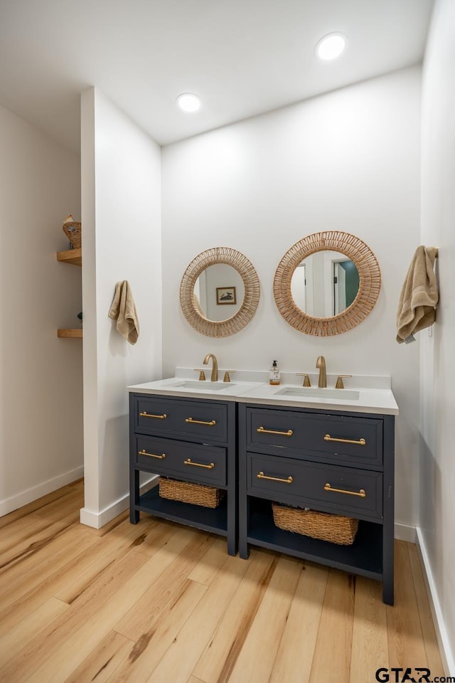 15683 Crk 472, Tyler, TX 75706 - bathroom with double vanity, wood finished floors, and recessed lighting