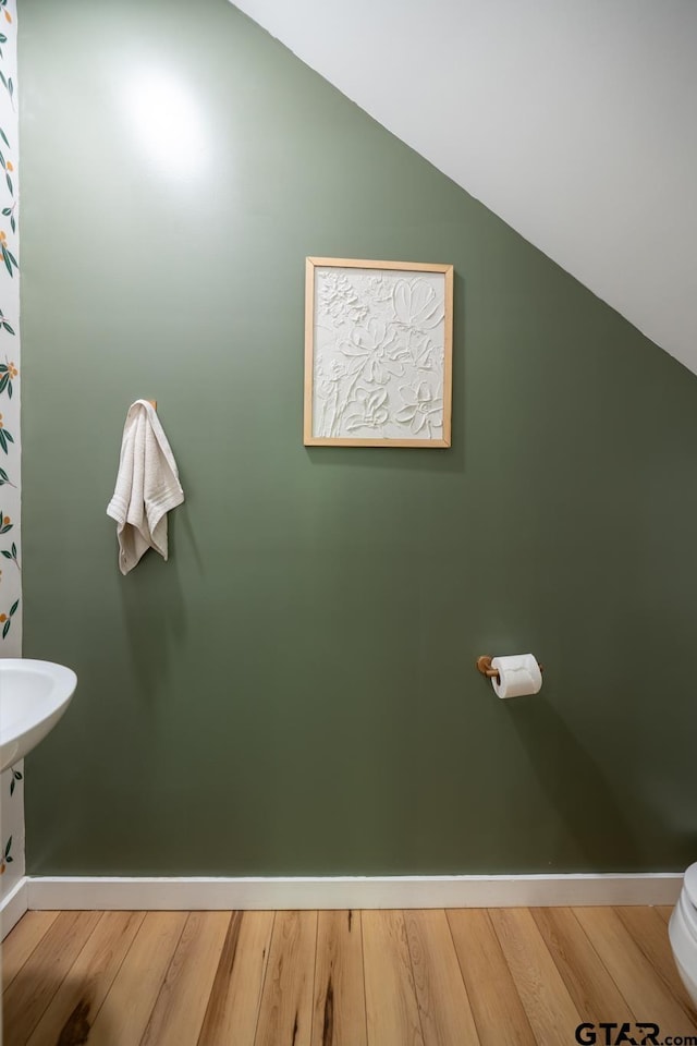 15683 Crk 472, Tyler, TX 75706 - bathroom with vaulted ceiling and wood finished floors