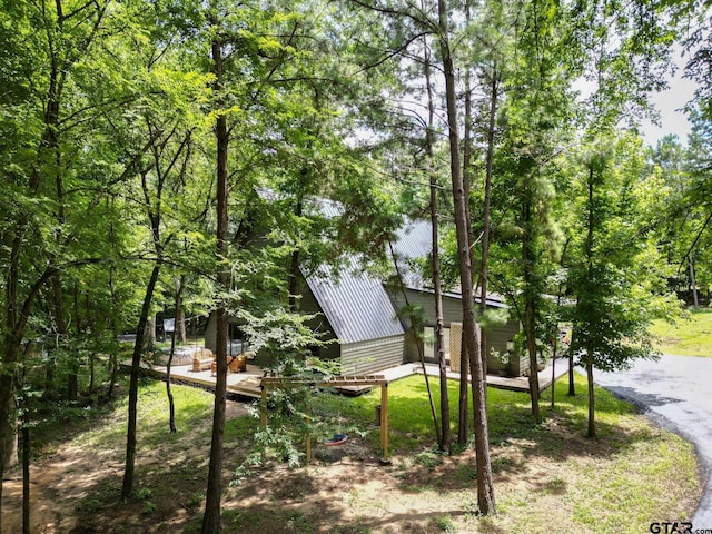 15683 Crk 472, Tyler, TX 75706 - view of side of property featuring a metal roof and a deck
