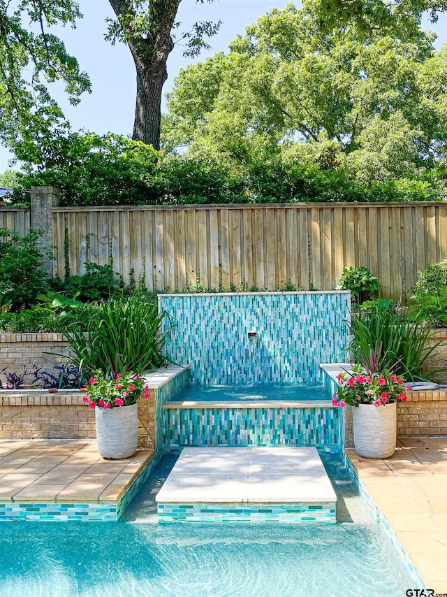 view of pool featuring a patio