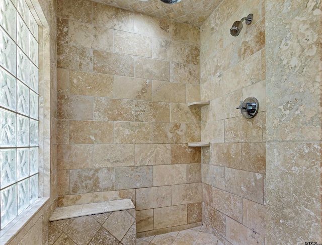 bathroom with tiled shower