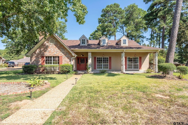 cape cod home featuring a front lawn