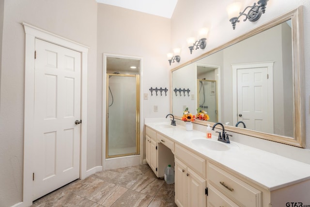 bathroom with vanity and a shower with shower door