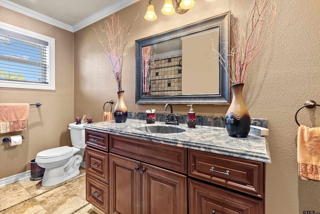 bathroom featuring vanity, toilet, and ornamental molding