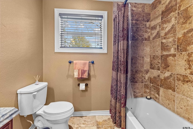 bathroom featuring shower / tub combo with curtain and toilet