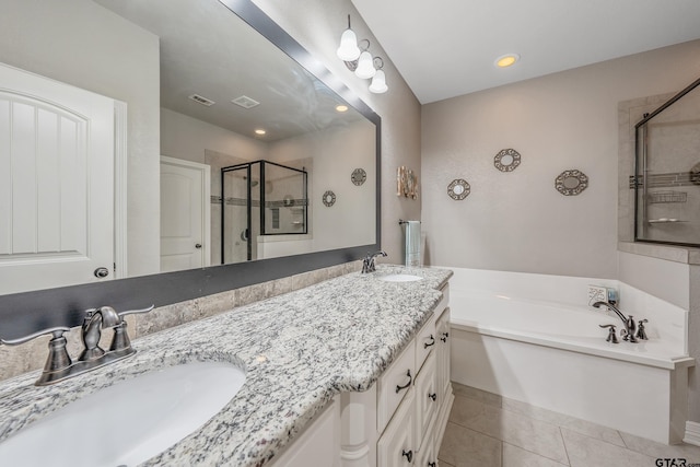 bathroom featuring separate shower and tub, tile patterned floors, and vanity