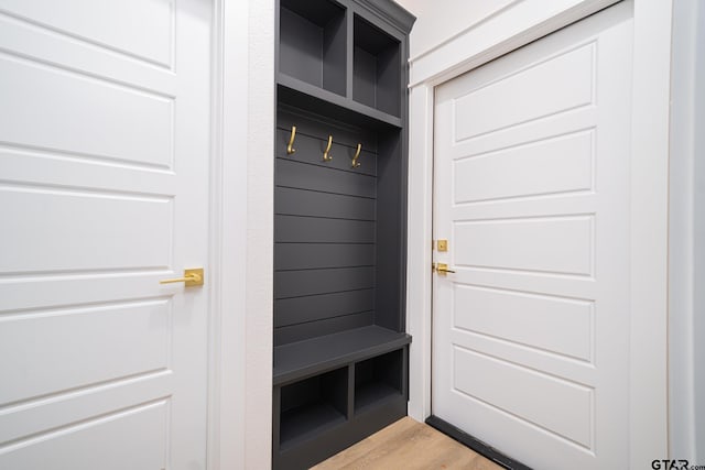 mudroom with light wood finished floors