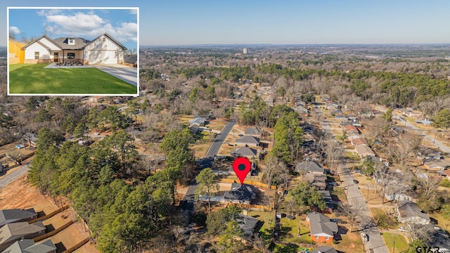 birds eye view of property with a residential view
