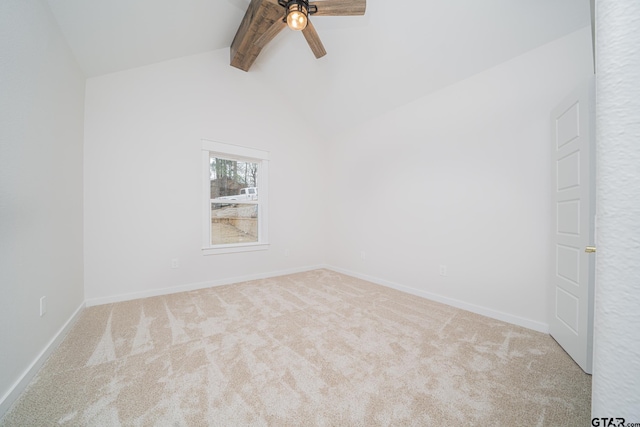 unfurnished room featuring baseboards, vaulted ceiling with beams, ceiling fan, and carpet floors
