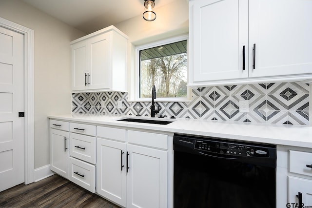 kitchen featuring white cabinets, backsplash, light countertops, a sink, and black dishwasher