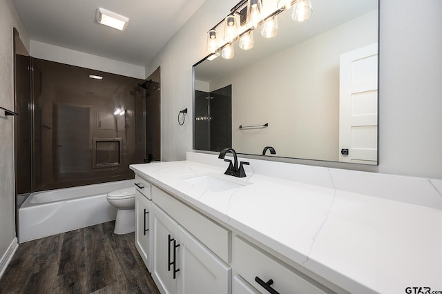 bathroom featuring shower / bath combination, wood finished floors, vanity, and toilet