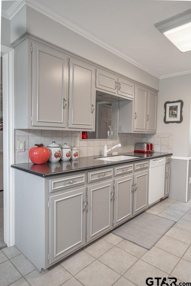 kitchen with dishwasher, decorative backsplash, sink, light tile patterned floors, and gray cabinets