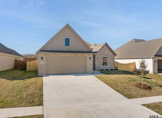 view of front of house with a front yard and a garage