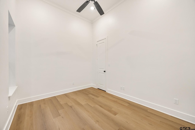 unfurnished room featuring ceiling fan, wood-type flooring, and crown molding