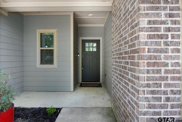 2609 Tulsa St, Tyler, TX 75702 - view of exterior entry featuring brick siding