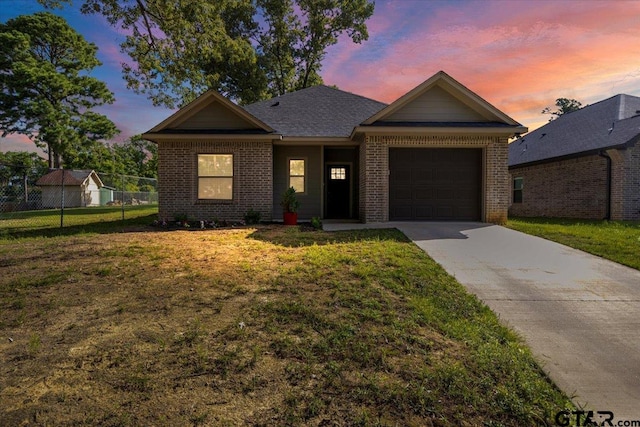 2609 Tulsa St, Tyler, TX 75702 - ranch-style home with brick siding, a garage, and concrete driveway