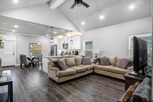 2609 Tulsa St, Tyler, TX 75702 - living area featuring dark wood finished floors, recessed lighting, ceiling fan, beamed ceiling, and high vaulted ceiling