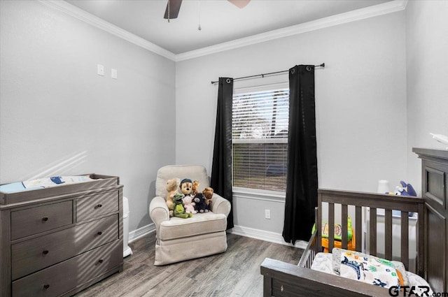2609 Tulsa St, Tyler, TX 75702 - bedroom featuring wood finished floors, ornamental molding, and ceiling fan