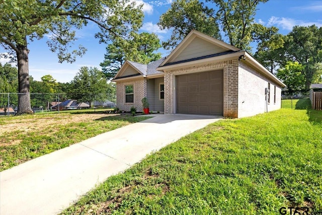 2609 Tulsa St, Tyler, TX 75702 - view of front of home featuring brick siding, a garage, and concrete driveway