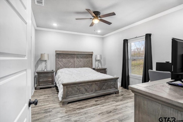 2609 Tulsa St, Tyler, TX 75702 - bedroom featuring wood finished floors, ornamental molding, a ceiling fan, and recessed lighting
