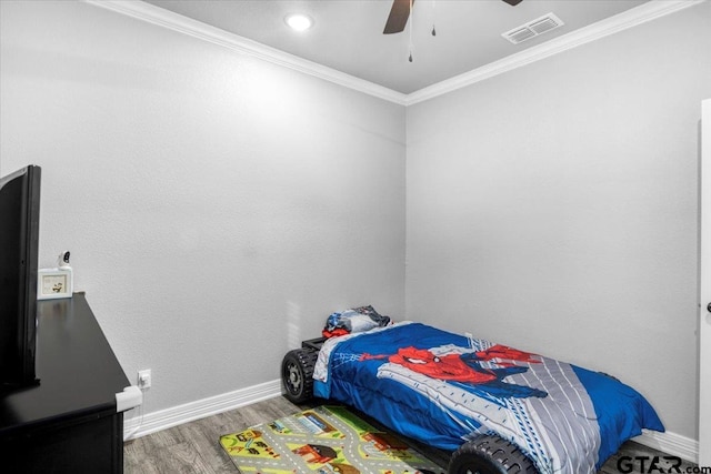 2609 Tulsa St, Tyler, TX 75702 - bedroom featuring wood finished floors, ornamental molding, and a ceiling fan