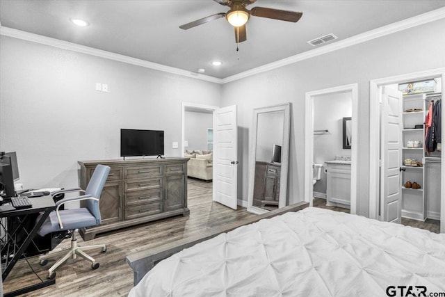 2609 Tulsa St, Tyler, TX 75702 - bedroom with ornamental molding, wood finished floors, an office area, recessed lighting, and connected bathroom