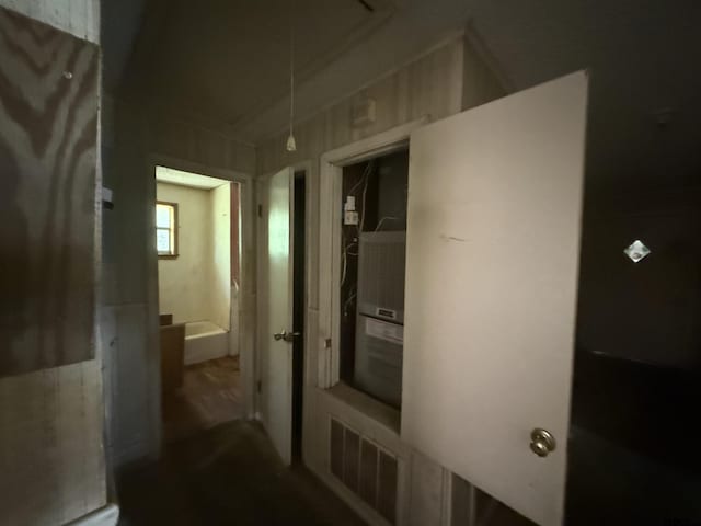 corridor featuring attic access and visible vents