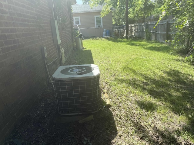 details featuring a fenced backyard and cooling unit