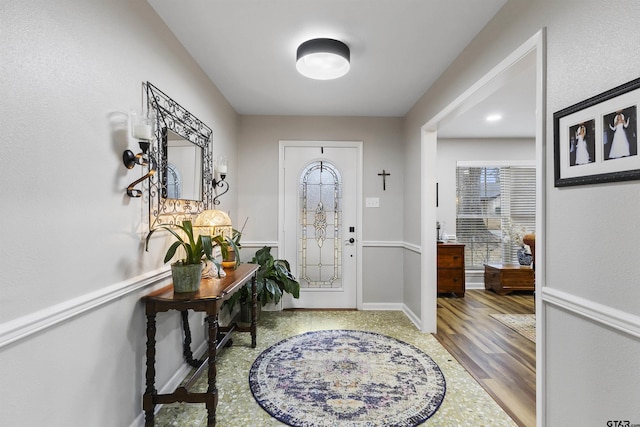 entrance foyer featuring a wealth of natural light and hardwood / wood-style floors