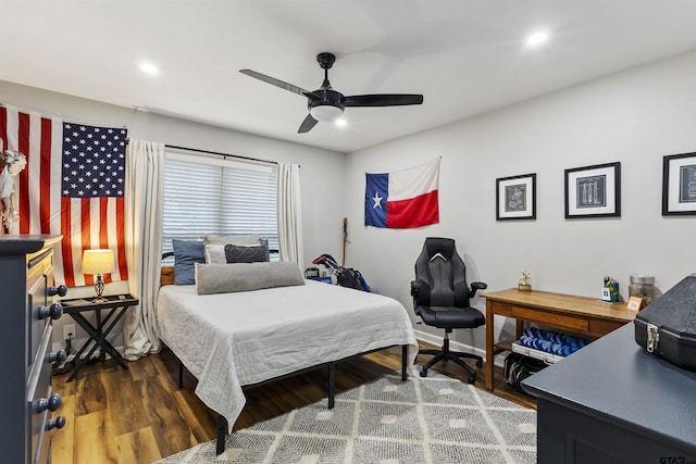 bedroom featuring dark wood-type flooring and ceiling fan