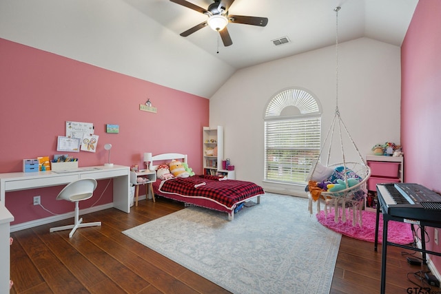 bedroom with a ceiling fan, vaulted ceiling, wood finished floors, and visible vents