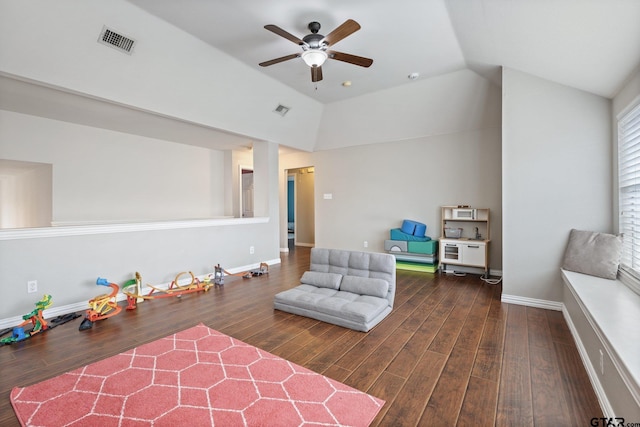 rec room with a ceiling fan, visible vents, wood finished floors, and vaulted ceiling