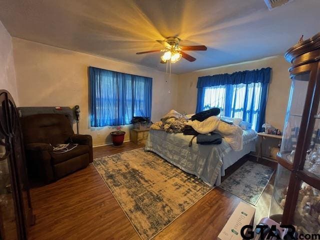 bedroom featuring wood-type flooring and ceiling fan