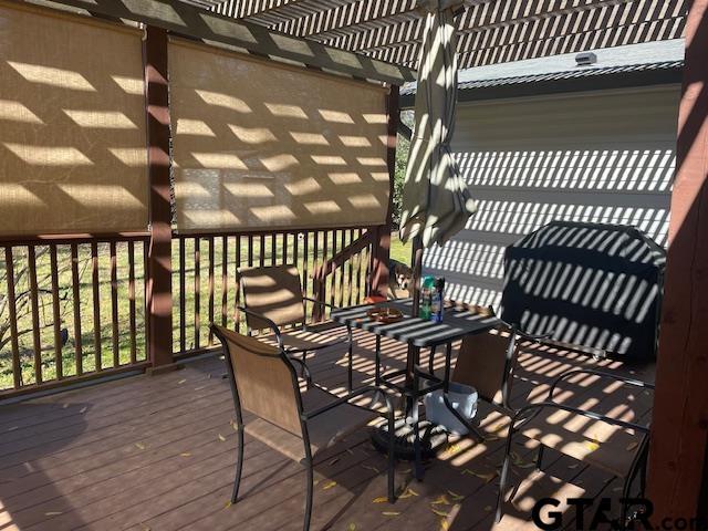 wooden terrace featuring a pergola