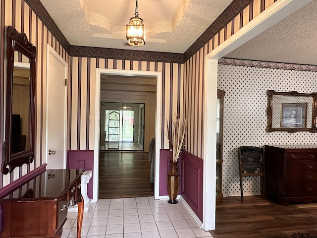 2203 S Williams Ave, Mount Pleasant, TX 75455 - hall with tile patterned flooring, wallpapered walls, and a textured ceiling