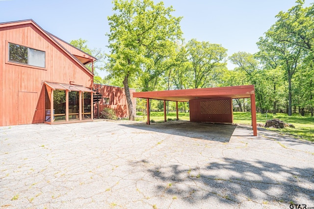 view of car parking with aphalt driveway